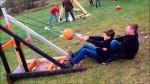 A young couple experiments with their own homemade catapult